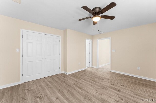1713 Boydton Plank Rd, Petersburg, VA 23805 - unfurnished bedroom with a closet, baseboards, ceiling fan, and light wood-type flooring