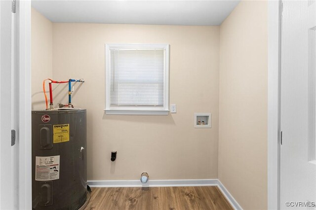 1713 Boydton Plank Rd, Petersburg, VA 23805 - laundry area featuring wood finished floors, hookup for an electric dryer, laundry area, baseboards, and electric water heater