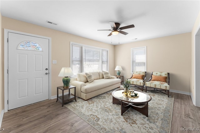 1713 Boydton Plank Rd, Petersburg, VA 23805 - living area with baseboards, visible vents, a ceiling fan, and wood finished floors