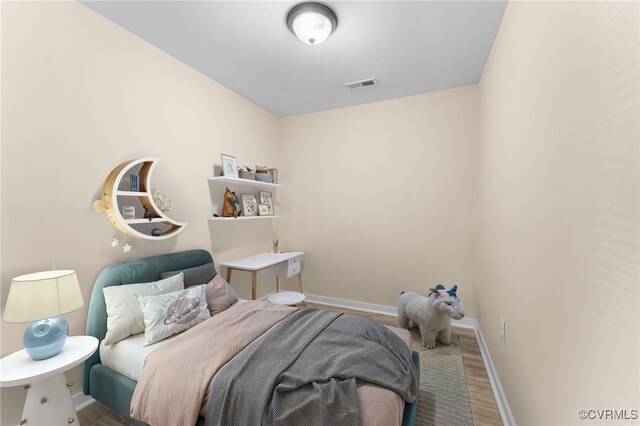 1713 Boydton Plank Rd, Petersburg, VA 23805 - bedroom featuring baseboards, visible vents, and wood finished floors