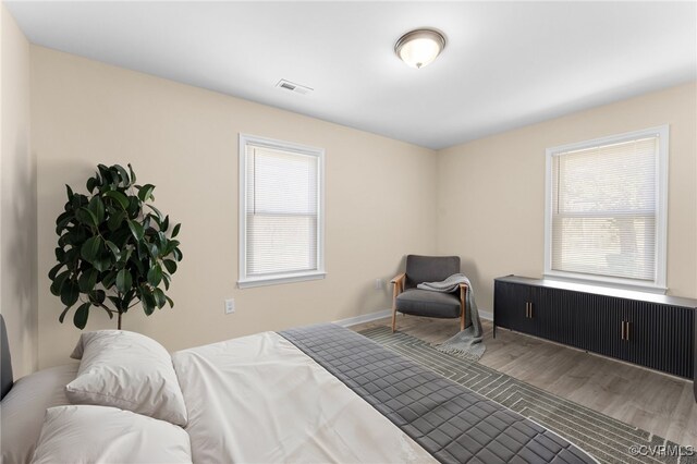 1713 Boydton Plank Rd, Petersburg, VA 23805 - bedroom with visible vents, baseboards, multiple windows, and wood finished floors