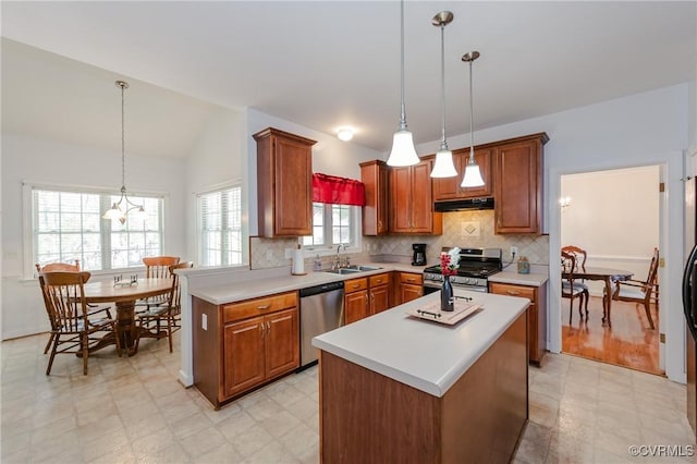 kitchen featuring stainless steel appliances, backsplash, light floors, light countertops, and under cabinet range hood