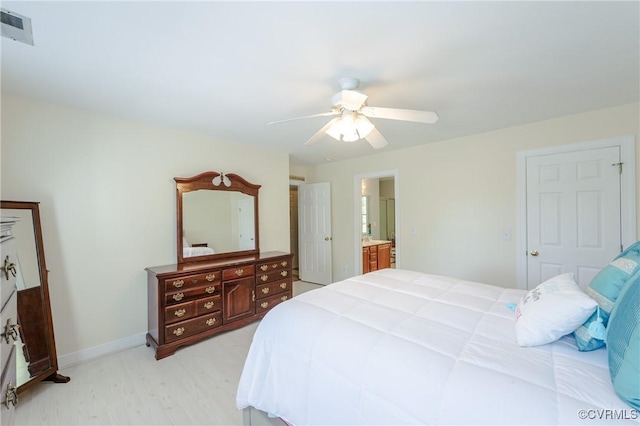 bedroom with light wood finished floors, baseboards, visible vents, ceiling fan, and connected bathroom
