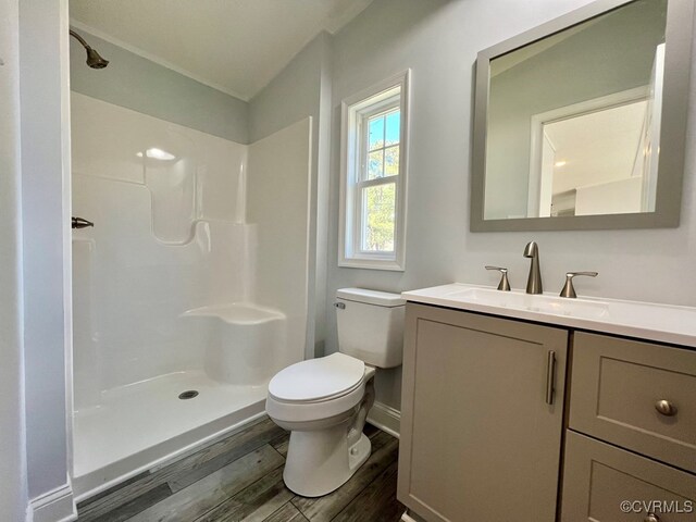 409 Remo Rd, Heathsville, VA 22473 - full bathroom featuring vanity, toilet, walk in shower, and wood finished floors