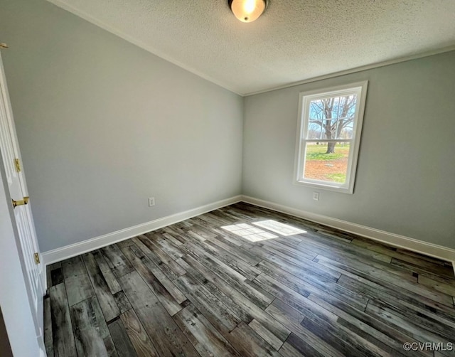 409 Remo Rd, Heathsville, VA 22473 - empty room featuring dark wood-style flooring, baseboards, and a textured ceiling