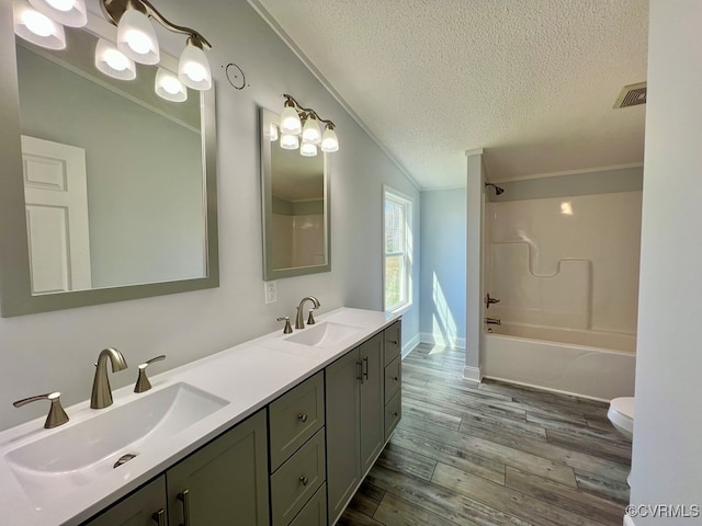 409 Remo Rd, Heathsville, VA 22473 - bathroom with a sink, ornamental molding, a textured ceiling, and wood finished floors