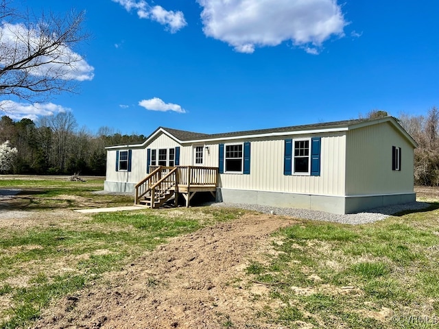 409 Remo Rd, Heathsville, VA 22473 - manufactured / mobile home featuring a front lawn