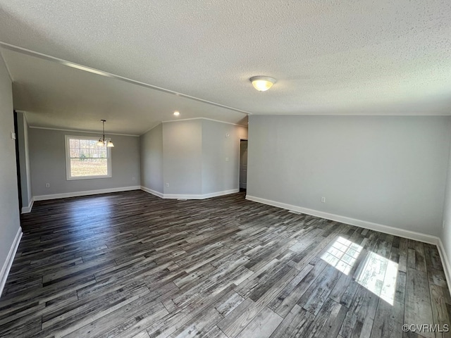 409 Remo Rd, Heathsville, VA 22473 - unfurnished room with baseboards, dark wood-style flooring, lofted ceiling, and an inviting chandelier