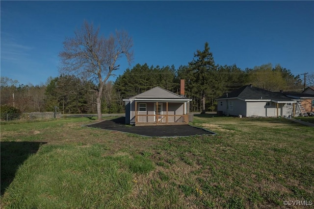 view of yard with covered porch