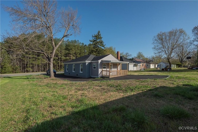view of yard with covered porch