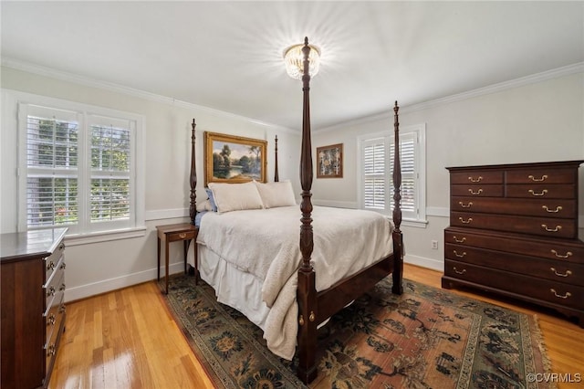 8203 Overbury Rd, Richmond, VA 23227 - bedroom with ornamental molding, multiple windows, and light wood-type flooring