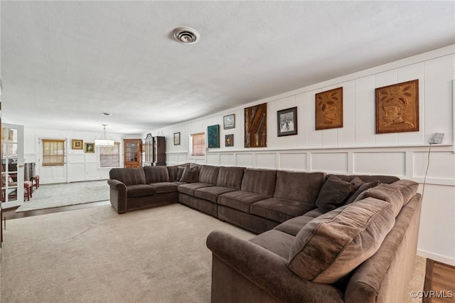 8203 Overbury Rd, Richmond, VA 23227 - living room featuring visible vents and a decorative wall