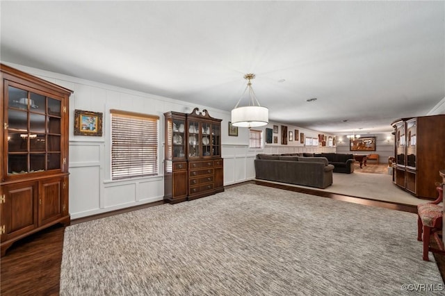 8203 Overbury Rd, Richmond, VA 23227 - living area with a decorative wall and wood finished floors