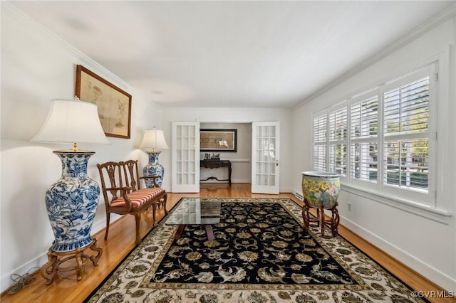 8203 Overbury Rd, Richmond, VA 23227 - sitting room with wood finished floors, ornamental molding, and french doors