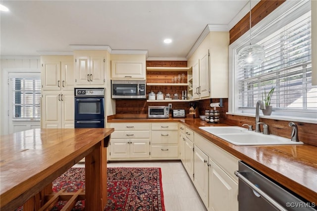 8203 Overbury Rd, Richmond, VA 23227 - kitchen featuring stainless steel appliances, butcher block counters, and a healthy amount of sunlight