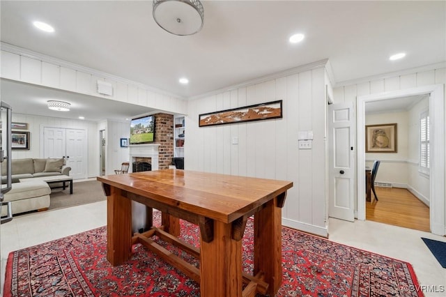 8203 Overbury Rd, Richmond, VA 23227 - dining area featuring a fireplace, recessed lighting, and ornamental molding