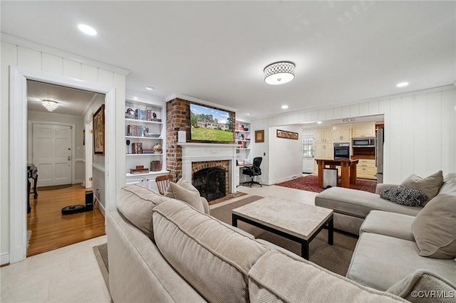 8203 Overbury Rd, Richmond, VA 23227 - living area featuring recessed lighting, a brick fireplace, built in features, and ornamental molding