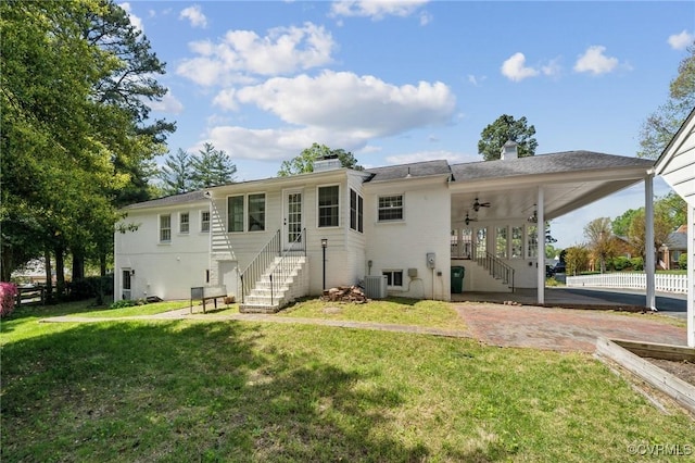 8203 Overbury Rd, Richmond, VA 23227 - rear view of property with central air condition unit, a chimney, stairs, ceiling fan, and a yard