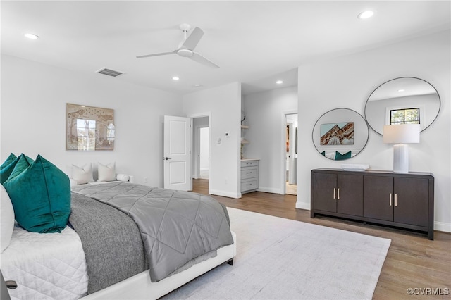 bedroom featuring wood finished floors, visible vents, recessed lighting, and a ceiling fan