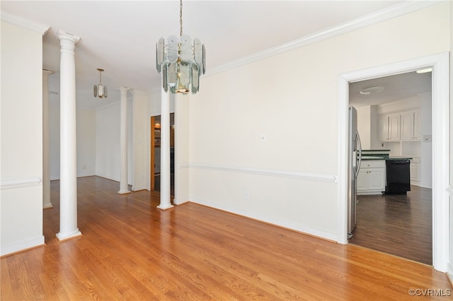14007 Spring Rd, Montpelier, VA 23192 - spare room featuring light wood-style floors, ornate columns, crown molding, a chandelier, and baseboards