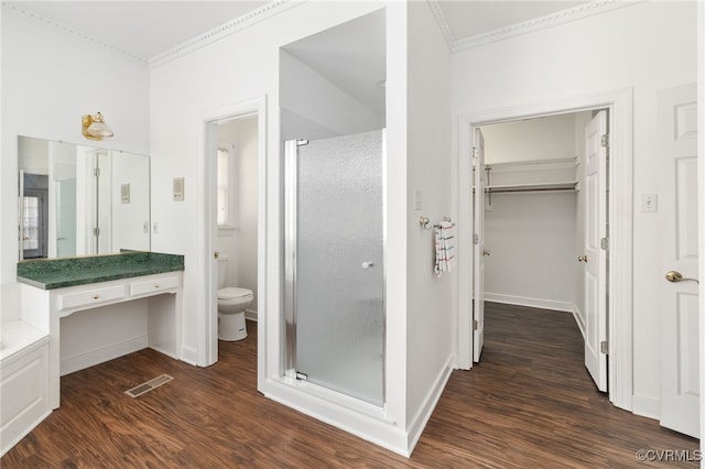 14007 Spring Rd, Montpelier, VA 23192 - full bath with ornamental molding, a shower stall, wood finished floors, toilet, and a walk in closet