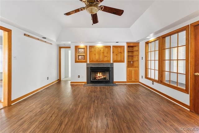 14007 Spring Rd, Montpelier, VA 23192 - unfurnished living room with vaulted ceiling, a fireplace with flush hearth, a ceiling fan, dark wood finished floors, and baseboards