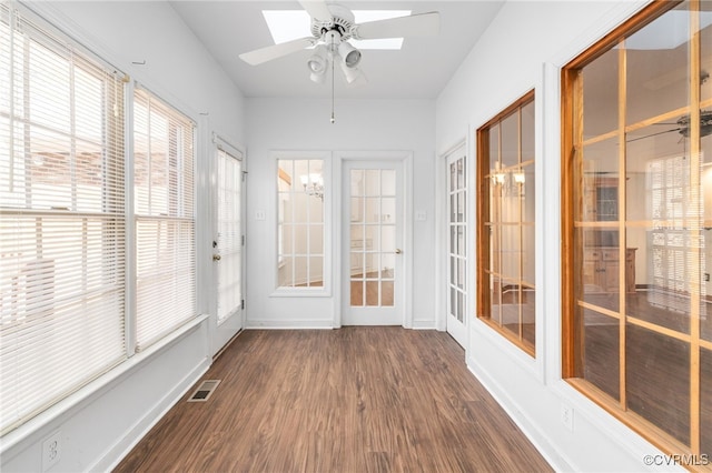 14007 Spring Rd, Montpelier, VA 23192 - unfurnished sunroom featuring wood finished floors, a skylight, and baseboards