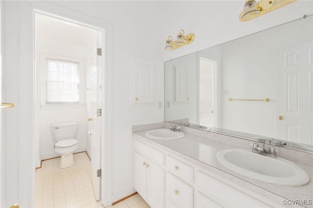 14007 Spring Rd, Montpelier, VA 23192 - full bath with toilet, double vanity, and baseboards