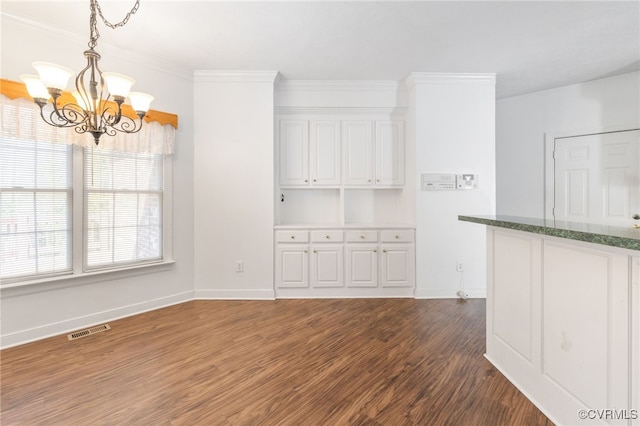 14007 Spring Rd, Montpelier, VA 23192 - unfurnished dining area with a chandelier, dark wood-type flooring, baseboards, and ornamental molding