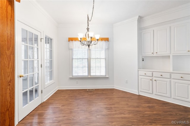14007 Spring Rd, Montpelier, VA 23192 - unfurnished dining area featuring a chandelier, plenty of natural light, dark wood-type flooring, crown molding, and baseboards