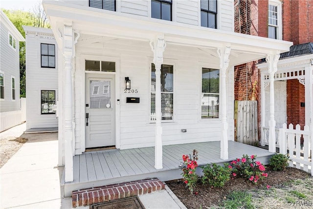 2205 Fairmount Ave, Richmond, VA 23223 - property entrance featuring a porch and fence