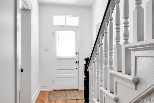 2205 Fairmount Ave, Richmond, VA 23223 - foyer entrance featuring light wood-style flooring, baseboards, and stairs