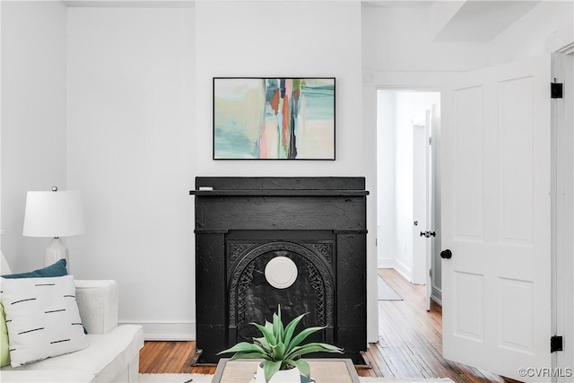 2205 Fairmount Ave, Richmond, VA 23223 - living area featuring wood finished floors and baseboards