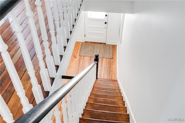 2205 Fairmount Ave, Richmond, VA 23223 - stairway with baseboards and wood finished floors
