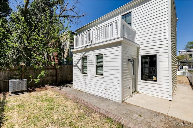 2205 Fairmount Ave, Richmond, VA 23223 - back of property featuring cooling unit, fence, and a balcony