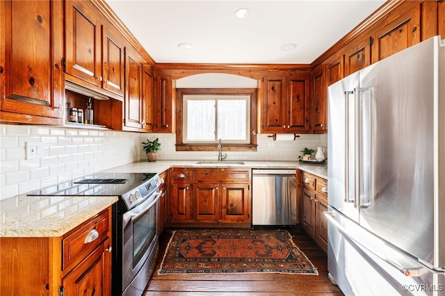 14304 Horseshoe Ford Rd, Ashland, VA 23005 - kitchen with tasteful backsplash, stainless steel appliances, brown cabinets, dark wood-style flooring, and a sink