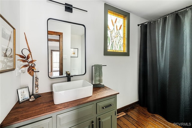 14304 Horseshoe Ford Rd, Ashland, VA 23005 - bathroom with wood finished floors, vanity, and baseboards