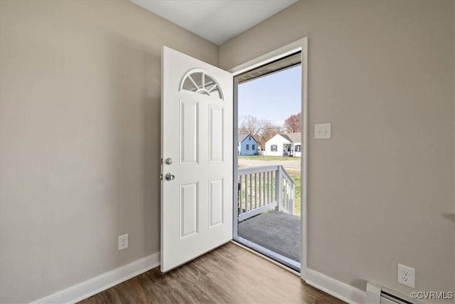 111 N Battery St, Highland Springs, VA 23075 - foyer entrance with baseboards, wood finished floors, and a baseboard radiator