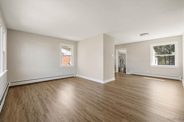 111 N Battery St, Highland Springs, VA 23075 - unfurnished room featuring a baseboard radiator, baseboard heating, wood finished floors, and baseboards