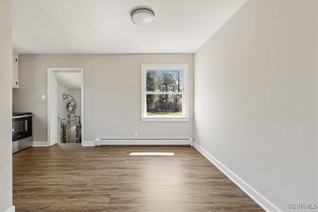 111 N Battery St, Highland Springs, VA 23075 - unfurnished living room featuring baseboard heating, wood finished floors, and baseboards