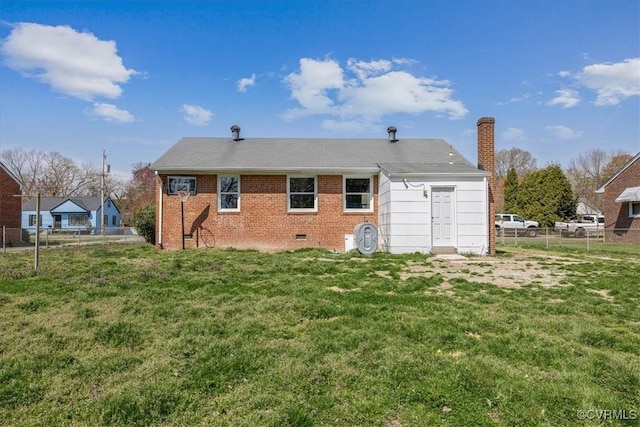 111 N Battery St, Highland Springs, VA 23075 - rear view of house featuring a chimney, brick siding, and crawl space
