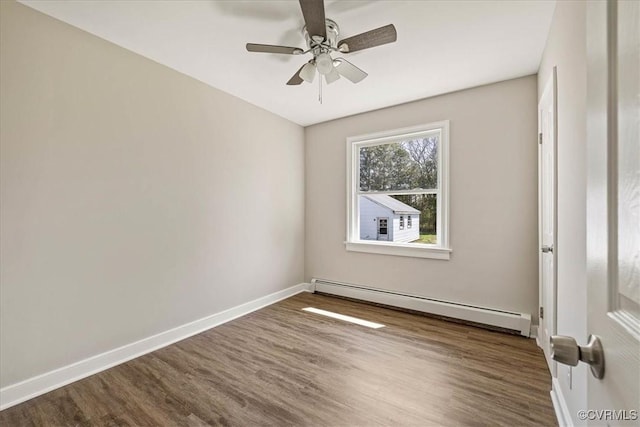 111 N Battery St, Highland Springs, VA 23075 - unfurnished room featuring baseboard heating, wood finished floors, baseboards, and ceiling fan