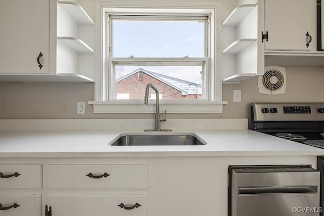 111 N Battery St, Highland Springs, VA 23075 - kitchen with open shelves, a sink, white cabinets, and light countertops
