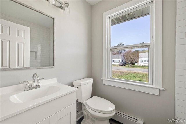 111 N Battery St, Highland Springs, VA 23075 - bathroom featuring baseboard heating, toilet, and vanity