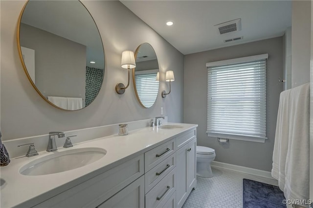 153 Thomas, Williamsburg, VA 23185 - bathroom with a sink, baseboards, and visible vents
