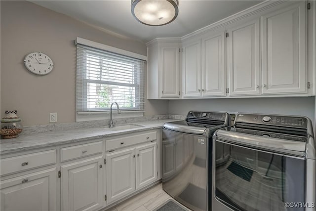 153 Thomas, Williamsburg, VA 23185 - washroom featuring a sink, cabinet space, and washer and clothes dryer