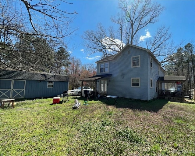 rear view of house with a yard