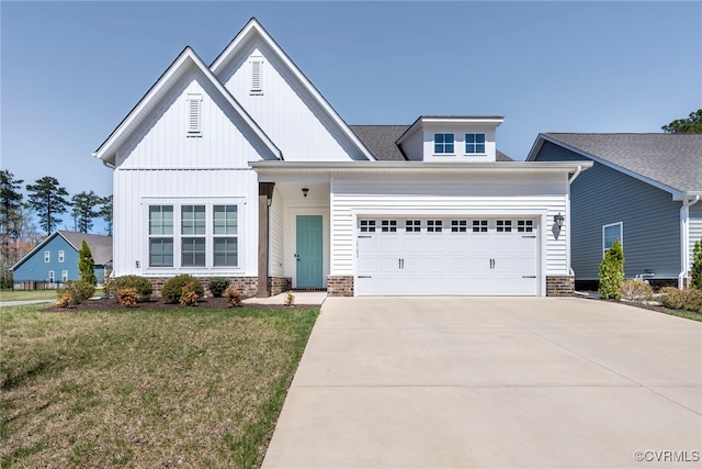 modern farmhouse with board and batten siding, a front lawn, a garage, and concrete driveway