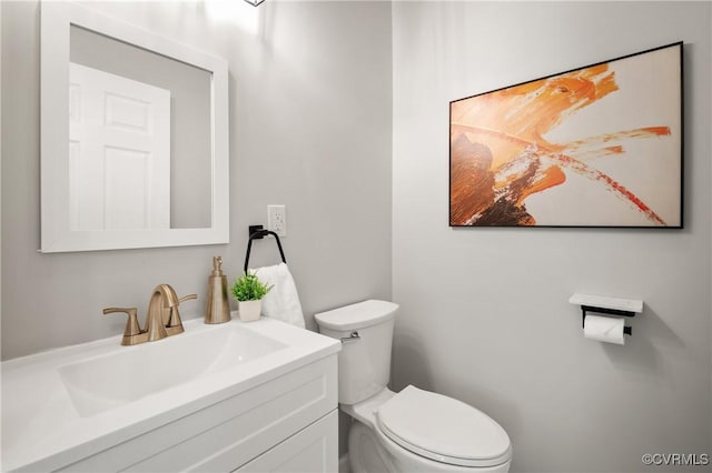 half bath with toilet and vanity