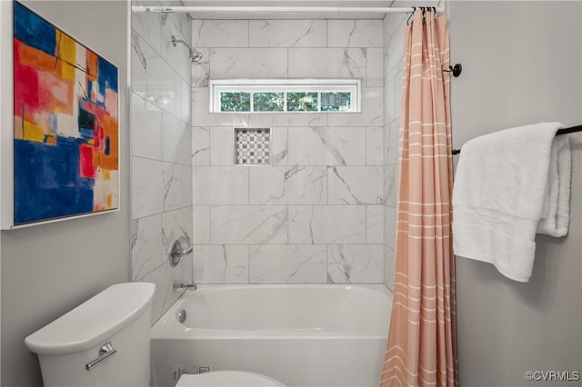 bathroom featuring shower / bath combination with curtain and toilet